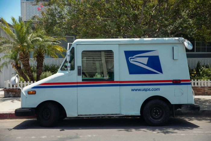 USPS mail truck parked on a street